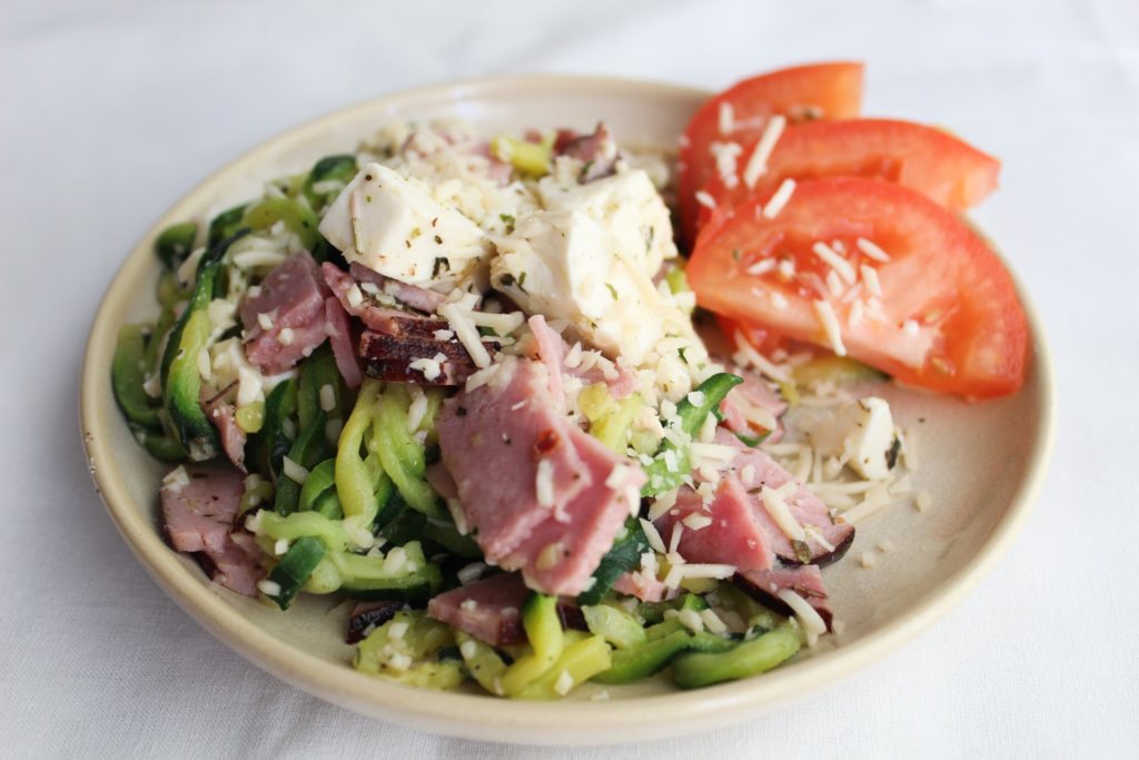 The perfect side dish to go along with your Italian Meal, or even to be eaten on its own! Loaded with the flavors of parmesan, ham, mozzarella, and italian seasoning, then finished off with the zip of vinegar.  This Keto Antipasto Bowl requires no special ingredients and comes together in under 5 minutes.