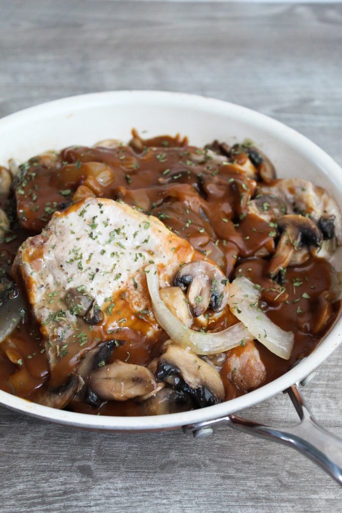 An easy on-pan meal the whole family will love, Skillet Pork Chops in Mushroom Gravy are low carb, ketogenic, a THM:S Fuel, and very cost effective if you're on a budget!