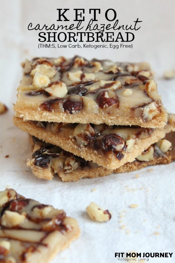 These Keto Shortbread cookies are layered with caramel and hazelnuts for the ultimate low-carb treat.  This recipe is included in my Complete Keto Holiday Cookbook, which is free, and releases 10/15/2018.