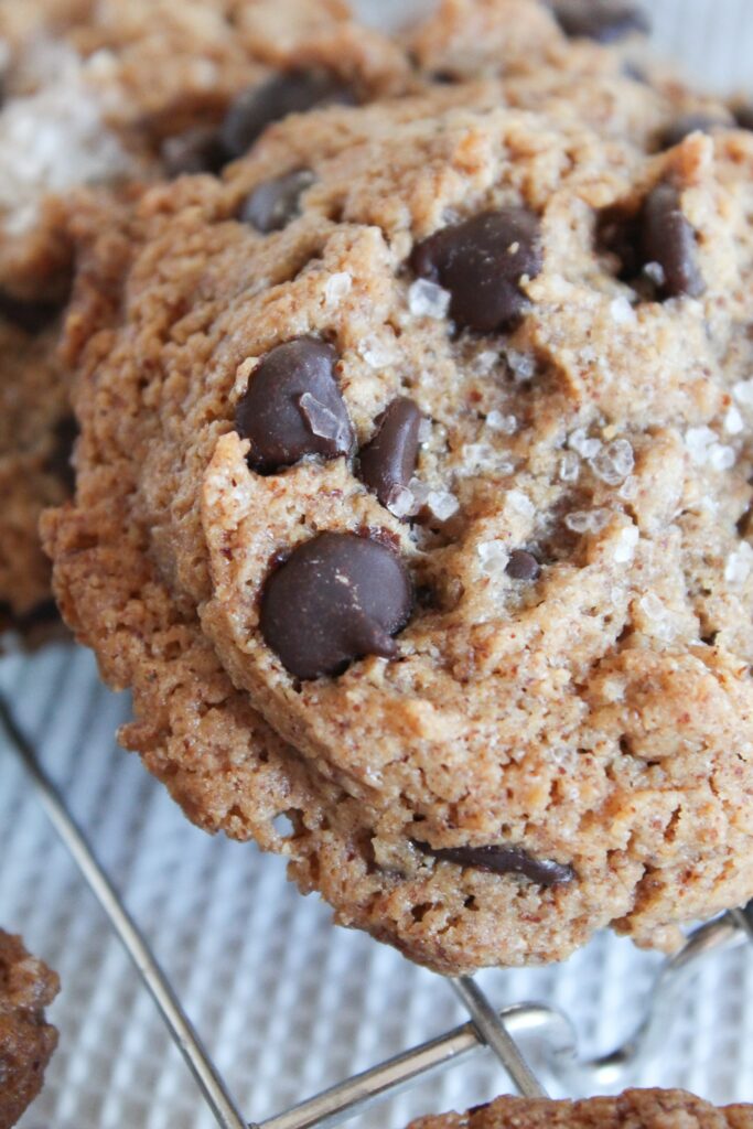 Perfectly chewy and melty, these Chewy Keto Chocolate Chip cookies have a sprinkle of sea salt for the perfect taste and texture.  Serve them warm for  taste of home!