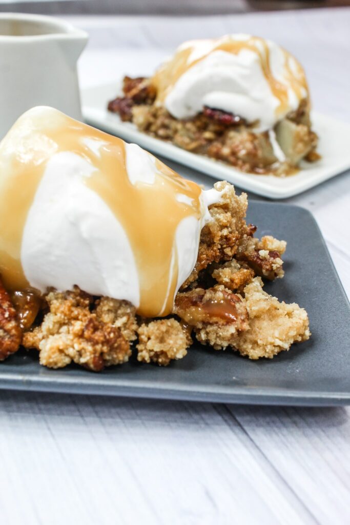 This delicious Keto Apple Crisp is a crowd-please whether you're surrounded by a keto crowd or not!  Keto Apple Crisp is a tradition in our family and is delicious served warm, with cold keto ice cream, and a keto butterscotch sauce.