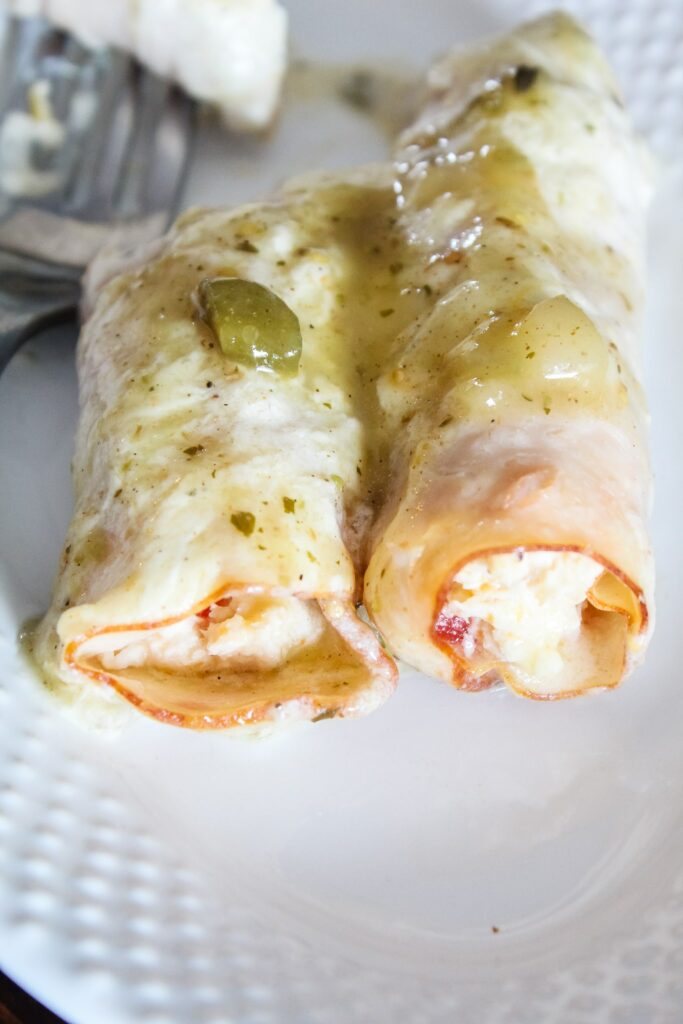 My Keto Chicken Enchiladas are made the high-fat, high-protein, and low carb with, with a delicious white verde sauce too!  They are SO easy to make and the whole family will love them!