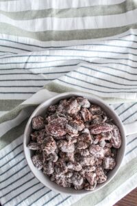An easy, healthy, Keto Puppy Chow Recipe {Keto Muddy Buddies} that uses ingredients you probably already have in your Keto kitchen!  With crunchy cereal bits coated in peanut butter, chocolate, and then powdered sweetener, this will satisfy any sweet craving you have!