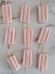 These Keto Popsicles are Strawberry Cheesecake and packed with protein from collagen and cottage cheese!  They're refreshing and sweet, yet healthy enough to eat guilt free!