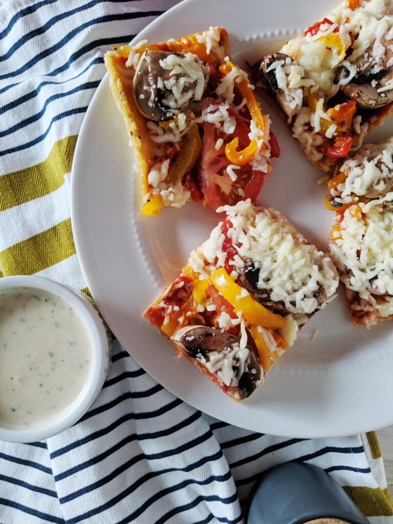 A low dairy, high protein crust that holds up to the heaviest of toppings, Keto Chicken Crust Pizza will become a staple in your household, requiring inexpensive ingredients, and coming together in only 15 minutes.