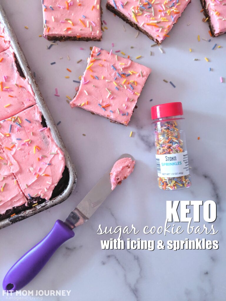 Soft, thick, and fluffy Keto Sugar Cookie Bars topped with a smooth, sweet frosting and sprinkles.  Baked in a sheet pan, these Keto Sugar Cookie Bars are great for a crowd!