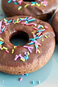 An easy to make Keto Chocolate Donut recipe.  Perfectly tender, with chocolate fudge icing - and even sprinkles! Keto Chocolate Donuts are delicious fresh out of the oven with a cup of coffee, or stored in the fridge and then reheated for 10 seconds in the microwave.