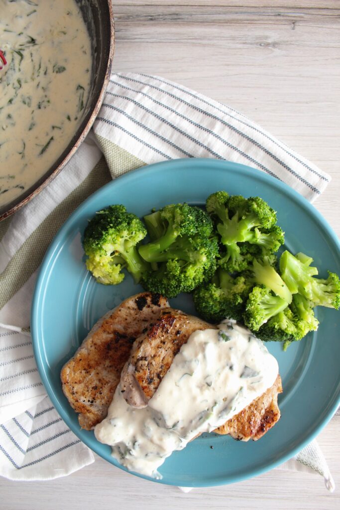 Packed with flavor, Pork Chops with Spinach Cream Sauce are tender, delicious, and an easy dinner the whole family will love!