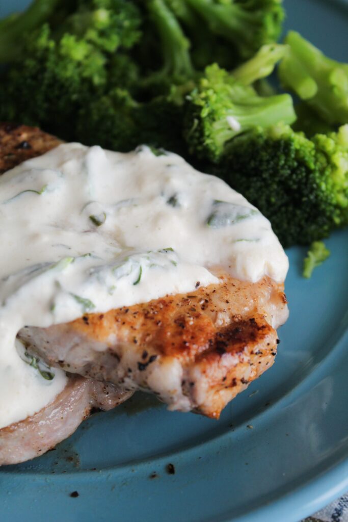 Packed with flavor, Pork Chops with Spinach Cream Sauce are tender, delicious, and an easy dinner the whole family will love!
