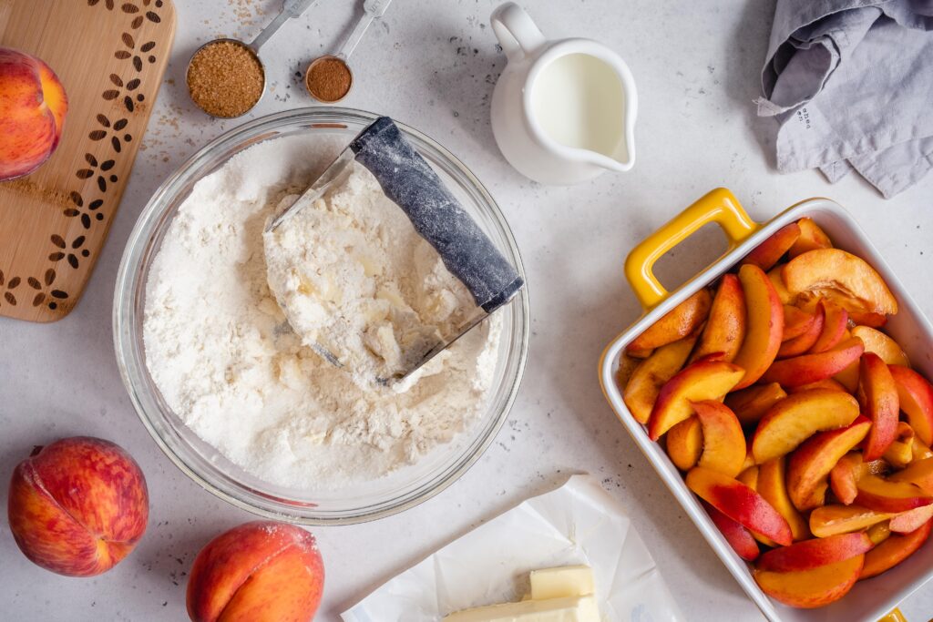 A healthy keto peach cobbler that is made grain free, gluten free, sugar free, ketogenic, and more!  Use fresh, in-season peaches for a delicious dessert that's perfect with a scoop of keto ice cream.