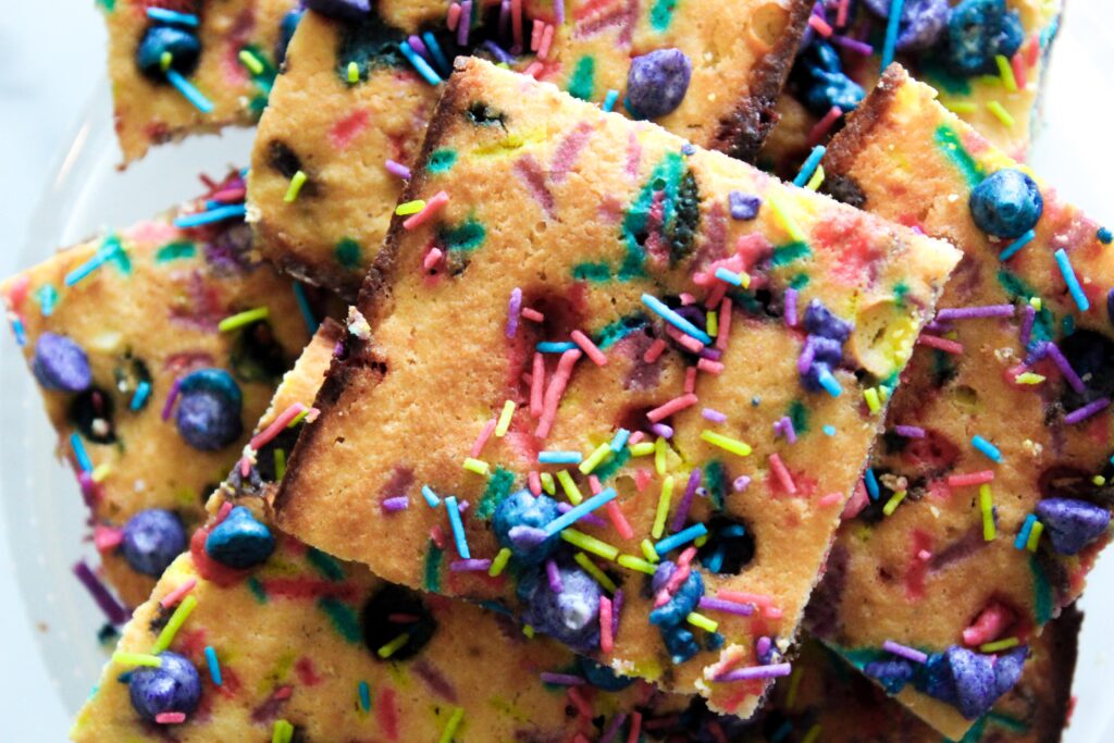 Keto Unicorn Blondies Made from scratch by my daughter's request!  Made with a chewy blondie base, colored keto white chocolate chips, and sugar free sprinkles, these are such a fun dessert!