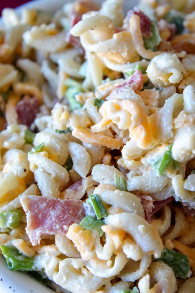 Low Carb Chicken Bacon Ranch Pasta Salad is a delicious lunch dish featuring shredded cheddar cheese, crumbled bacon, chopped green onions, and white meat chicken tossed in mayo and ranch dressing.