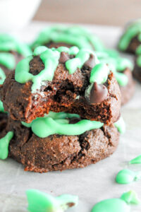 Like eating mint chocolate chip ice cream in cookie form, these Keto Mint Chocolate Chip Cookies in a warm, fresh-from-the-oven cookie! They're soft chocolate cookies, with sugar free mint chocolate chips, and drizzled with mint colored icing!  Delicious and healthy!