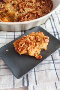 Low Carb Pumpkin Dump Cake is a super easy recipe that will quickly become a fall go-to.  It's made with keto sugar cookie mix, pumpkin, spices, butter, and pecans!