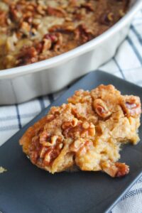 Low Carb Pumpkin Dump Cake is a super easy recipe that will quickly become a fall go-to.  It's made with keto sugar cookie mix, pumpkin, spices, butter, and pecans!