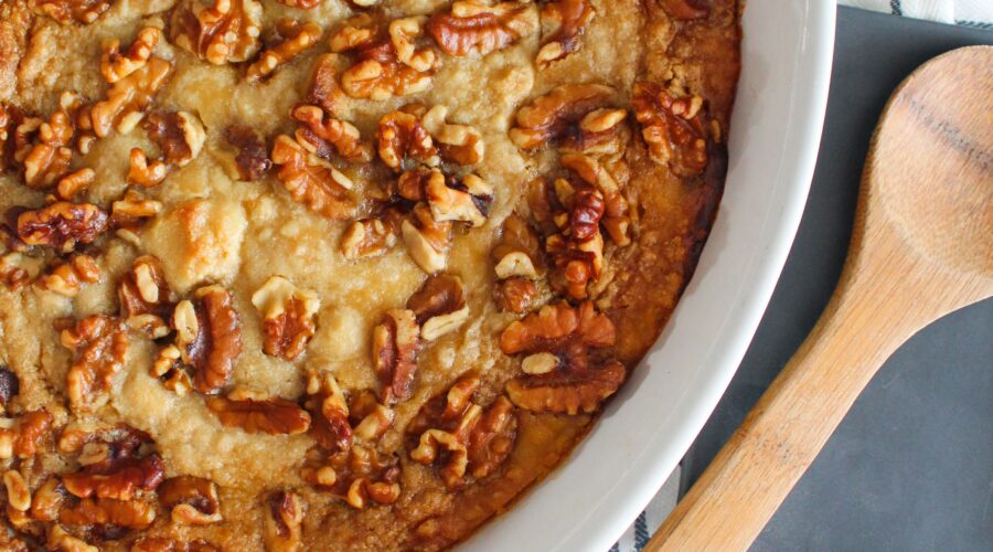 Low Carb Pumpkin Dump Cake is a super easy recipe that will quickly become a fall go-to. It's made with keto sugar cookie mix, pumpkin, spices, butter, and pecans!