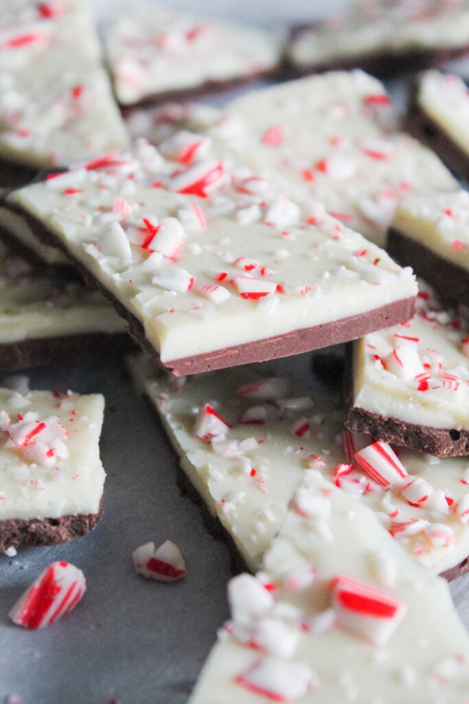 Low Carb Peppermint Bark is so easy!  Simple layer of keto white peppermint white chocolate, milk chocolate, and sugar free candy canes make for one of the easiest - and tastiest - low carb, ketogenic, holiday desserts!