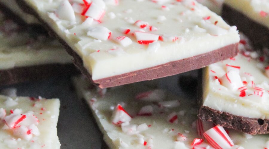 Low Carb Peppermint Bark is so easy! Simple layer of keto white peppermint white chocolate, milk chocolate, and sugar free candy canes make for one of the easiest - and tastiest - low carb, ketogenic, holiday desserts!