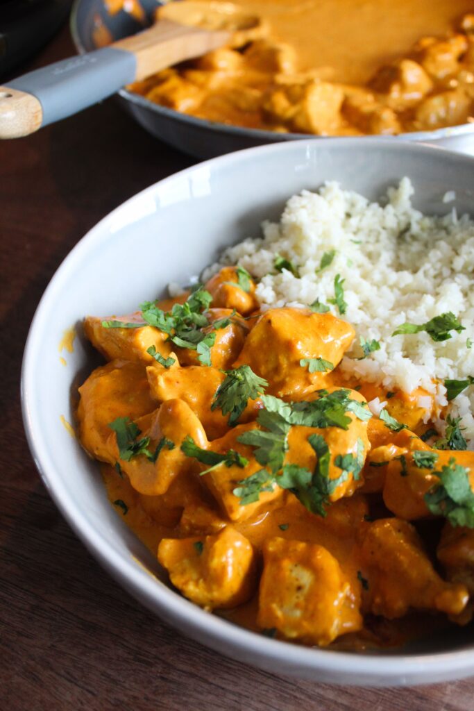30-Minute Keto Butter Chicken is bursting with flavor!  Cooks in 2 pans and goes well with cauliflower rice or other veggies.