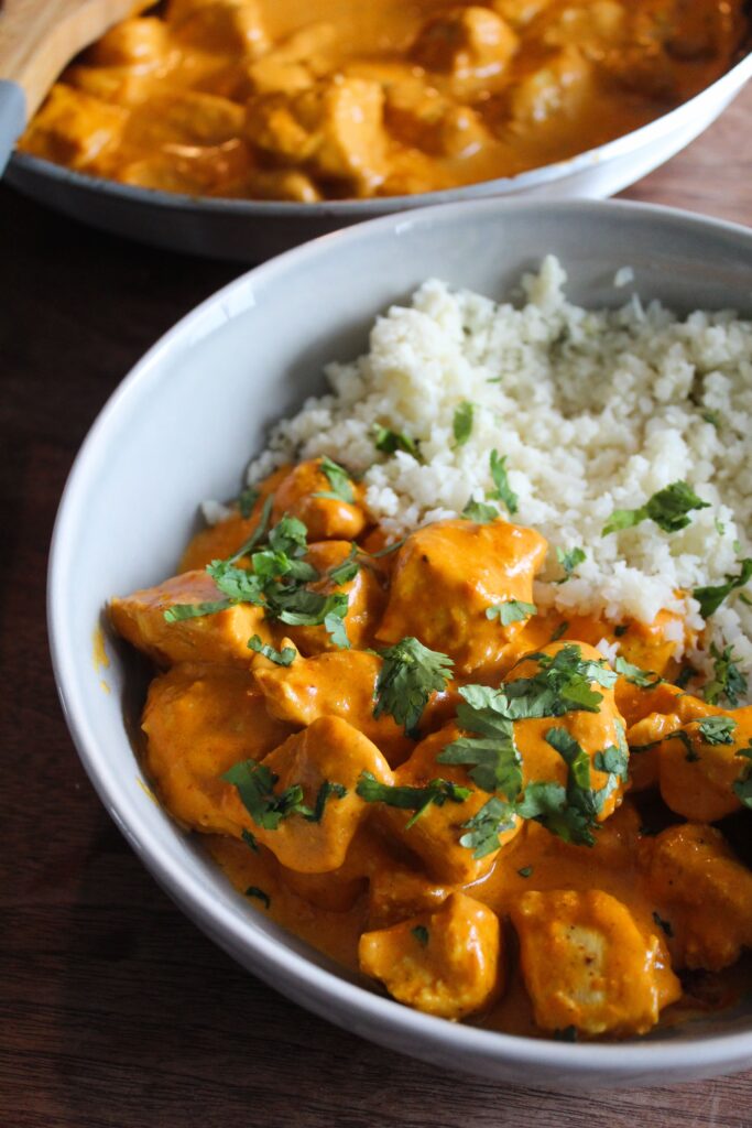 30-Minute Keto Butter Chicken is bursting with flavor!  Cooks in 2 pans and goes well with cauliflower rice or other veggies.