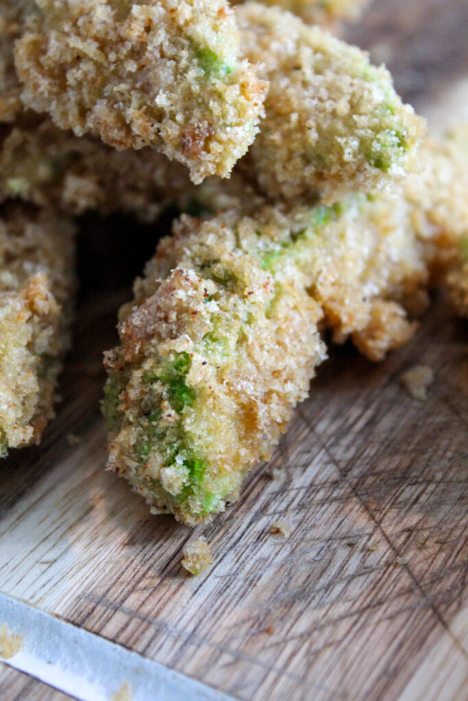 Fresh avocado slices coated in crispy pork rind breadcrumbs and baked until crispy and delicious.  These Crispy Keto Avocado fries are easy to make and sure to impress.
