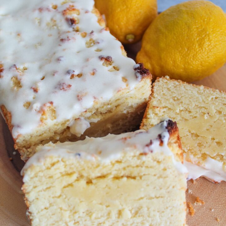 This moist Keto Lemon Loaf is fluffy, tangy & sweet, and very easy to make.  It requires not special ingredients but still hangs onto the flavor and texture of certain chain's beloved lemon loaf that goes so well with coffee.  Top it with a sweet lemon glaze for a delicious treat!