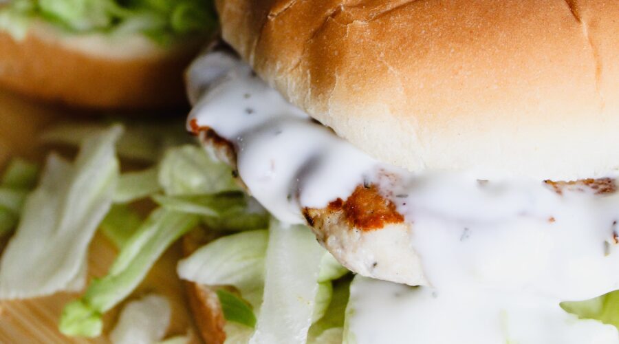 Keto Greek Chicken Burgers with feta cheese, sundried tomatoes, and spinach are packed with flavor, juicy, and incredibly macro-friendly. Throw them on the grill for an easy weeknight dinner, then warm them up for leftovers the next day.