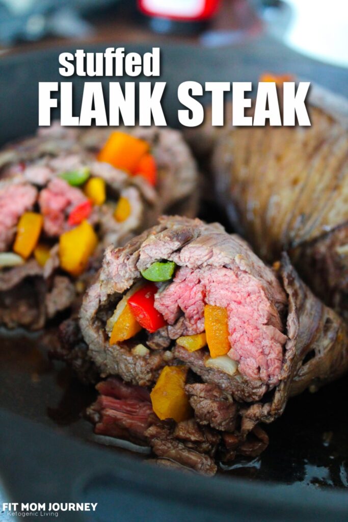 Flank Steak marinated then stuffed with bell peppers and onions.  Marinate, roll, and bake, then finish in the oven for a delicious dinner!