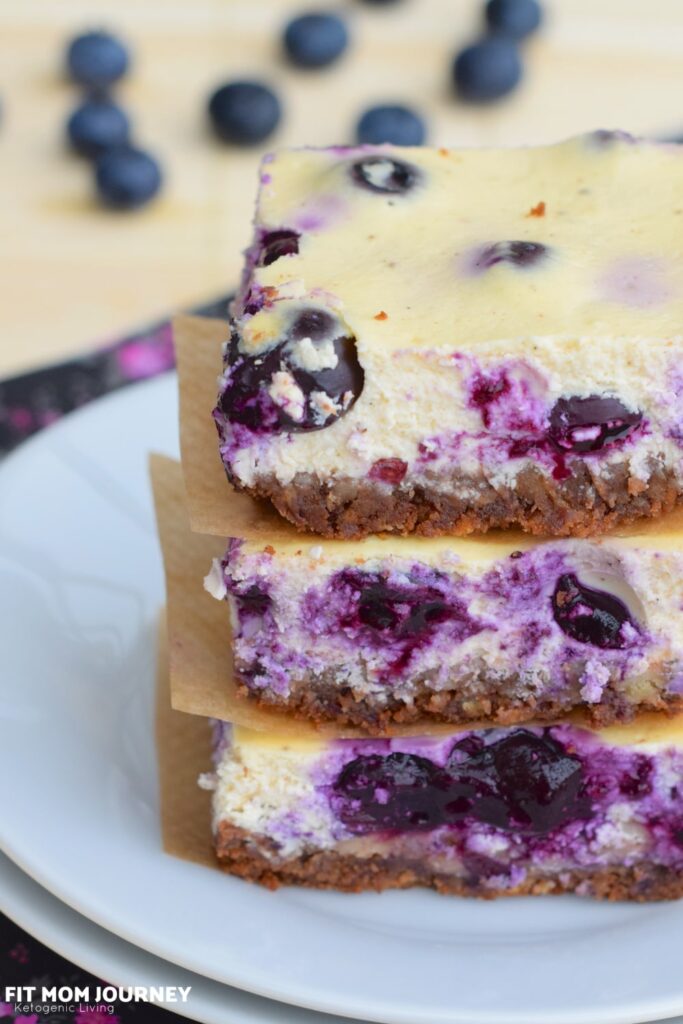Creamy cheesecake swirled with blueberries.  Baked a simple graham-like ketogenic crust, these Keto Blueberry Cheesecake Squares are a refreshing dessert!