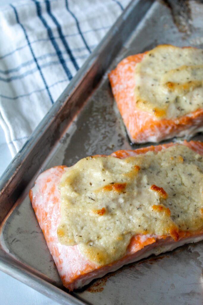 Simple Parmesan Crusted Salmon is a tender, flaky, baked salmon topped with a crust of parmesan and herbs.  Simple, flavorful, using no special ingredients.  Low Carb, Ketogenic, and a THM:S.
