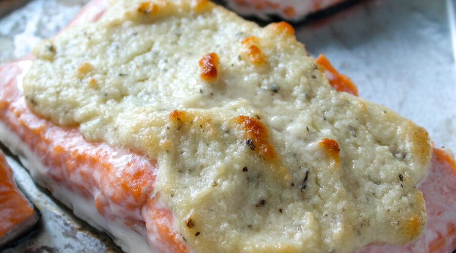 Simple Parmesan Crusted Salmon is a tender, flaky, baked salmon topped with a crust of parmesan and herbs. Simple, flavorful, using no special ingredients. Low Carb, Ketogenic, and a THM:S.