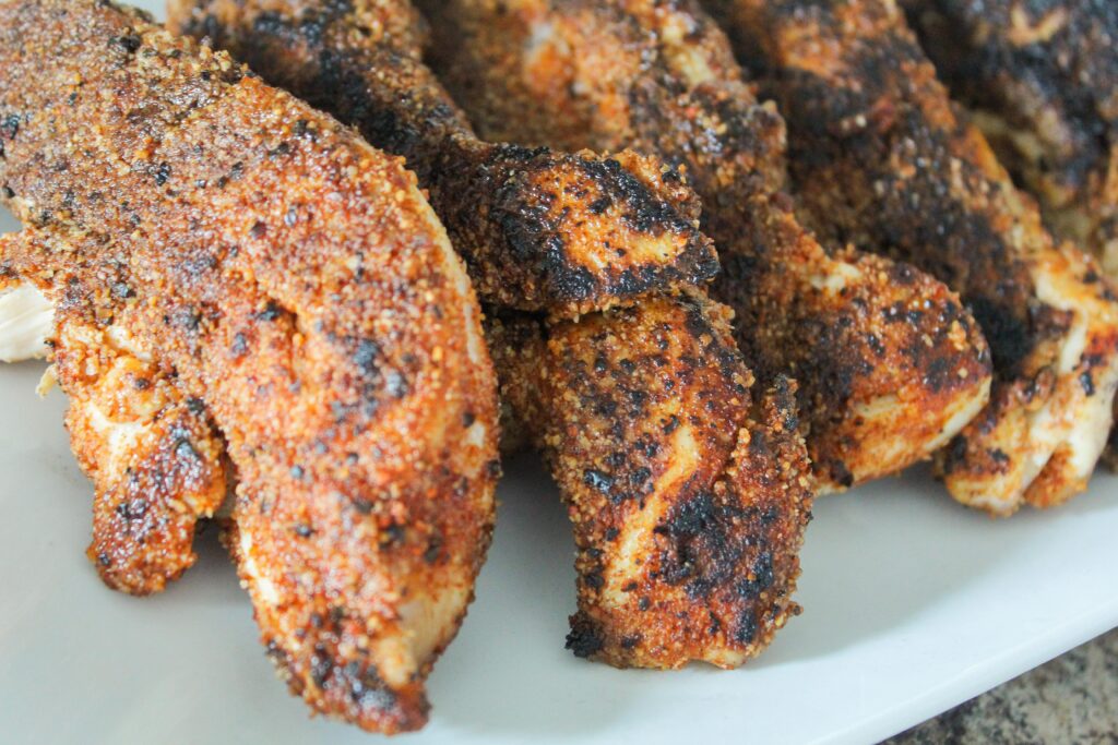 Fast-food copycat Blackened Chicken Tenders are my take on a cult favorite.  Paired with a creamy ranch, coleslaw, and vegetables they make a great dinner ready in 20 minutes.