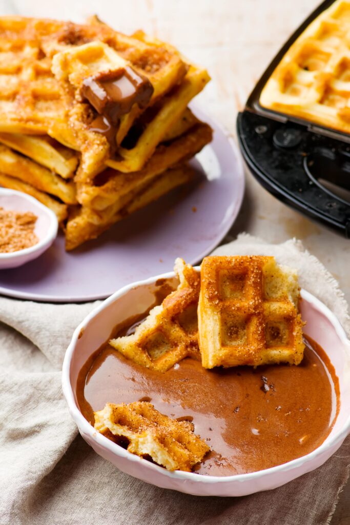 Keto Pumpkin Waffles are the more moist cousin of regular old keto waffles, made especially for fall!  They take only 1 bowl to make, and freeze well so you can  make them in bulk and have on hand to throw in the toaster!