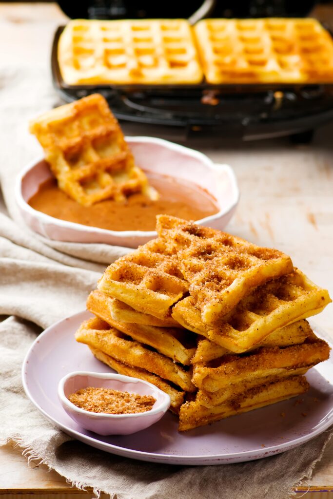 Keto Pumpkin Waffles are the more moist cousin of regular old keto waffles, made especially for fall!  They take only 1 bowl to make, and freeze well so you can  make them in bulk and have on hand to throw in the toaster!