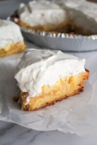 The best tasting Keto Lemon Sour Cream Pie! The perfect texture, stabilized whipped cream, and just a hint of sweetness makes for a crowd pleasing pie.