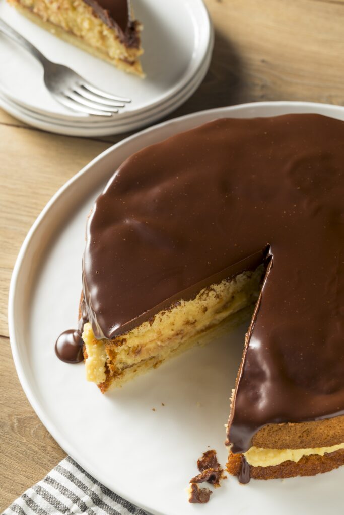 A delicious, classic dessert made low carb, Keto Boston Cream Pie uses moist yellow cake, and an unbelievably easy custard filling, and chocolate ganache.  