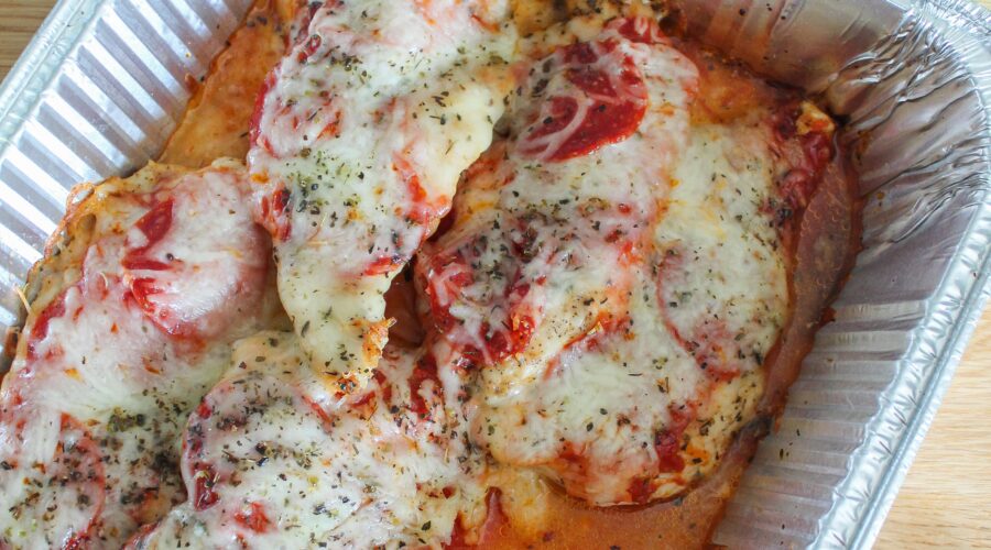 Need the easiest keto dinner ever? Make Keto Pizza Chicken! Baked Chicken topped with marinara, pepperoni, and melty mozzarella makes a super simple dinner everyone will love.