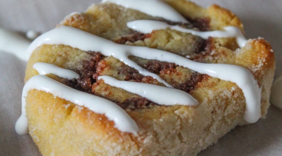 Keto Cinnamon Roll cookies are one of my favorite ways to repurpose keto sugar cookies into something cool! Roll up the dough with a buttery sweet cinnamon filling, bake, and drizzle with vanilla icing. The soften centers and slightly crisp outers mimic yeast cinnamon rolls - but without all the carbs and sugars!