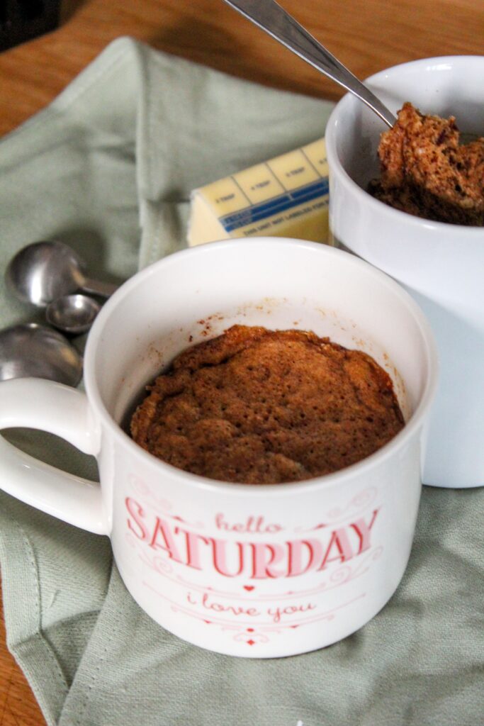 A quick and easy keto gingerbread mug cake perfect for the holiday season - but done in 90 seconds!  This mug cake is moist, spiced with molasses, ginger, and other spices.
