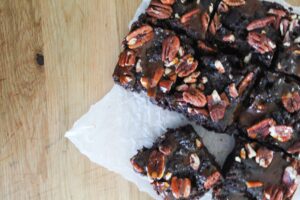 The perfect, fudgy low carb Keto Turtle Brownies are topped with sugar free caramel and chopped pecans.  So good you won't know the difference!