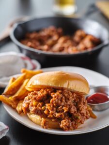 A simple recipe for homemade Keto Sloppy Joes that is free of sugar using unsweetened ketchup, veggies, and ground beef that still tastes like the real thing!  Ready in 20 minutes for a super simple dinner
