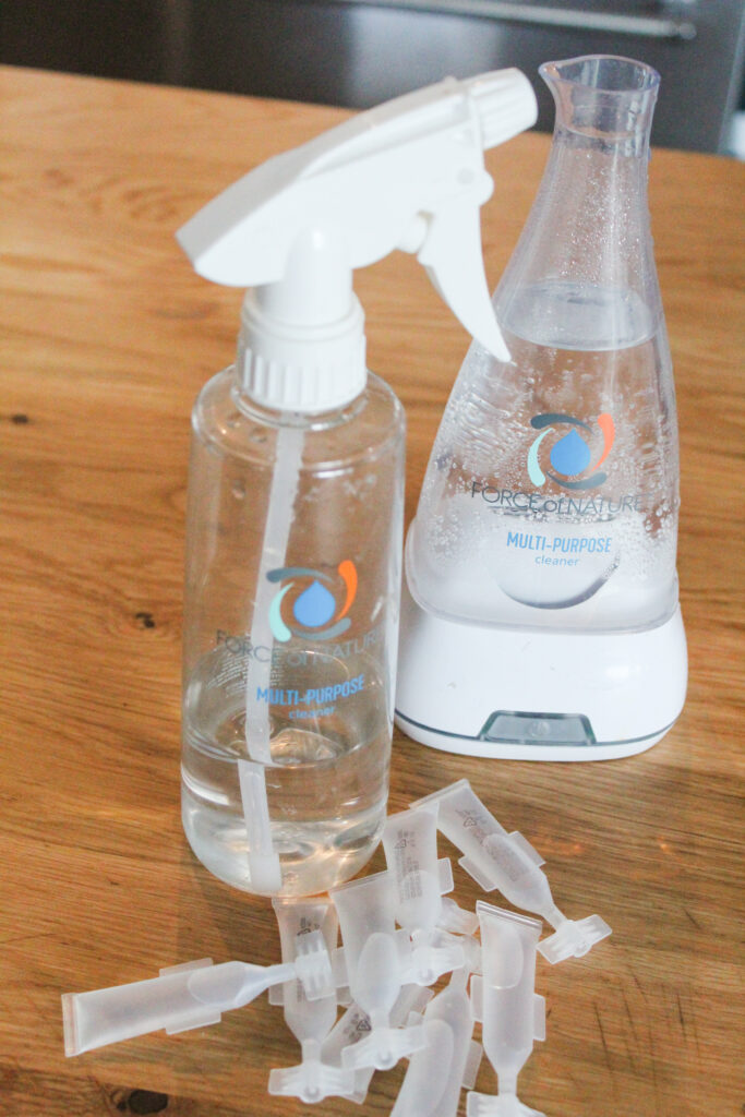 Force of Nature Cleaner uses vinegar, salt, water, and electricity to create a cleaner that is effective as bleach at sanitizing - but without harsh chemicals, bleaching clothing, or toxic fragrances. This is my honest Force of Nature Cleaner review after using it for more than 6 months.