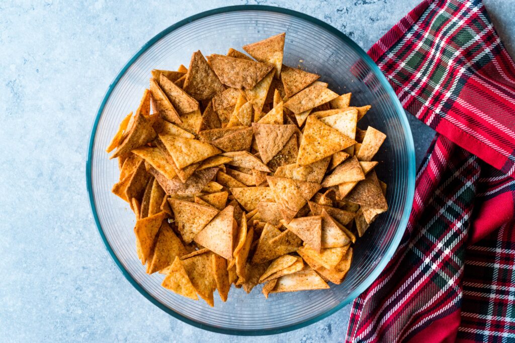 3 Ingredients are all you need to make Air Fryer Keto Tortilla Chips in under 10 minutes! This easy recipe produces salty, crispy chips that are the best snack and can be dipped in salsa, guacamole, or even made into nachos!