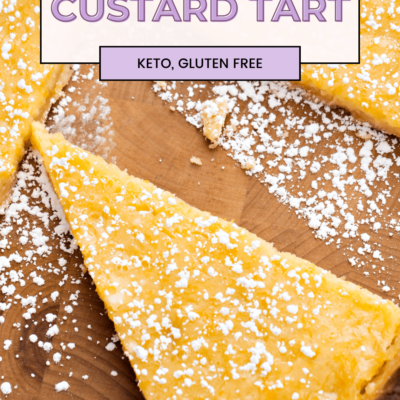 Keto Custard Pie is one of the best keto desserts to make ahead of time for a Mother's Day or Easter. It features a buttery almond flour crust, egg custard made from egg yolks, melted butter and almond milk, made in a tart pan for a beautiful finish with only 3 g net carbs per serving.