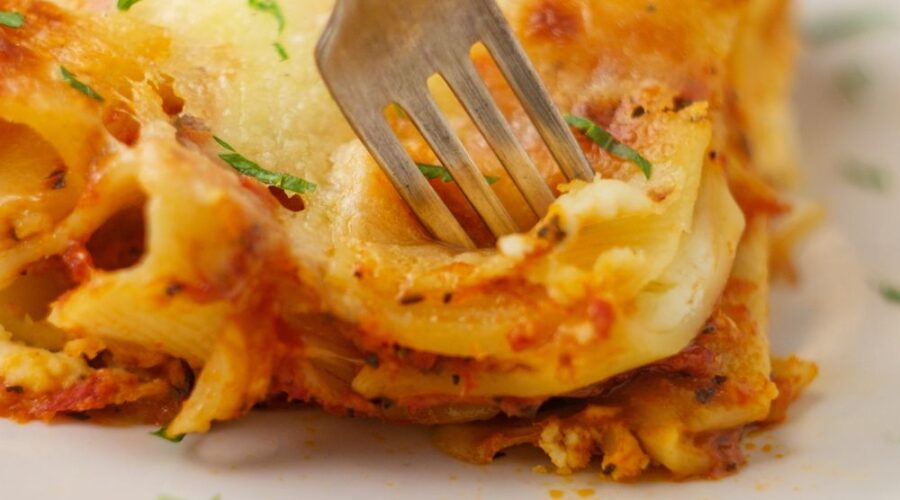 Keto baked ziti is a low carb twist on a classic recipe. You'll love how hearty and cheesy this comfort food dish is. Made with meat sauce, low carb noodles, and sugar free marinara, this is one of our favorite recipes for it's cheesy goodness!
