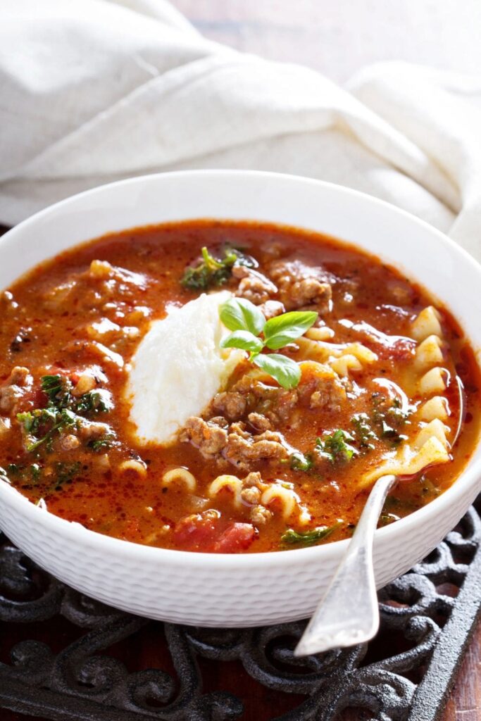 This Keto Lasagna soup is a big pot of comforting soup that the whole family will love. It's packed with full of herbs, tomato sauce, sauteed onions, ground beef and tons of cheese.  Can be made with or without low carb noodles, and always high protein.