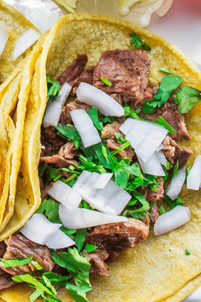 Quick, easy & authentic Keto Steak Street Tacos you can make in 10 minutes at home! Topped with onion, cilantro and lime juice, they SO good as well as being low carb, ketogenic, and high protein.