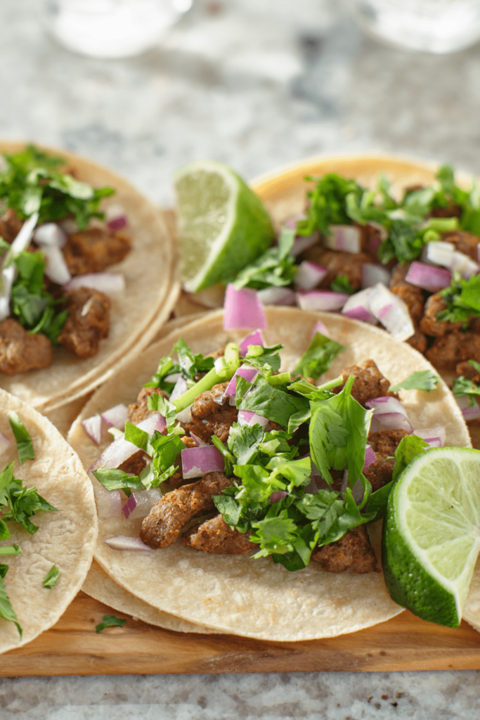 Quick, easy & authentic Keto Steak Street Tacos you can make in 10 minutes at home! Topped with onion, cilantro and lime juice, they SO good as well as being low carb, ketogenic, and high protein.